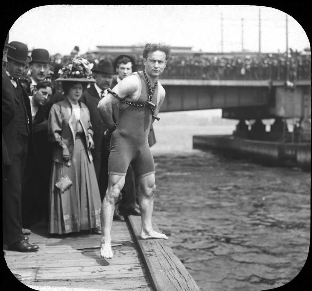 Harry Houdini performing an escape act
